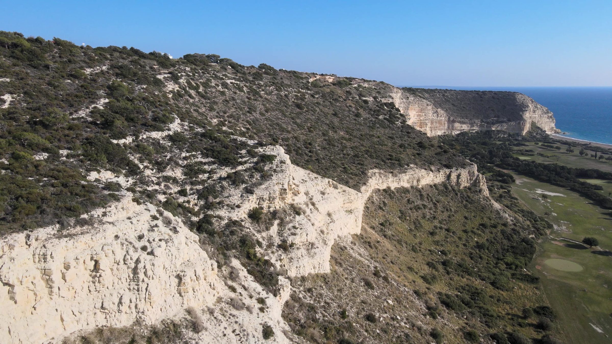 Happy Valley from the cliffs, the course running down to the sea